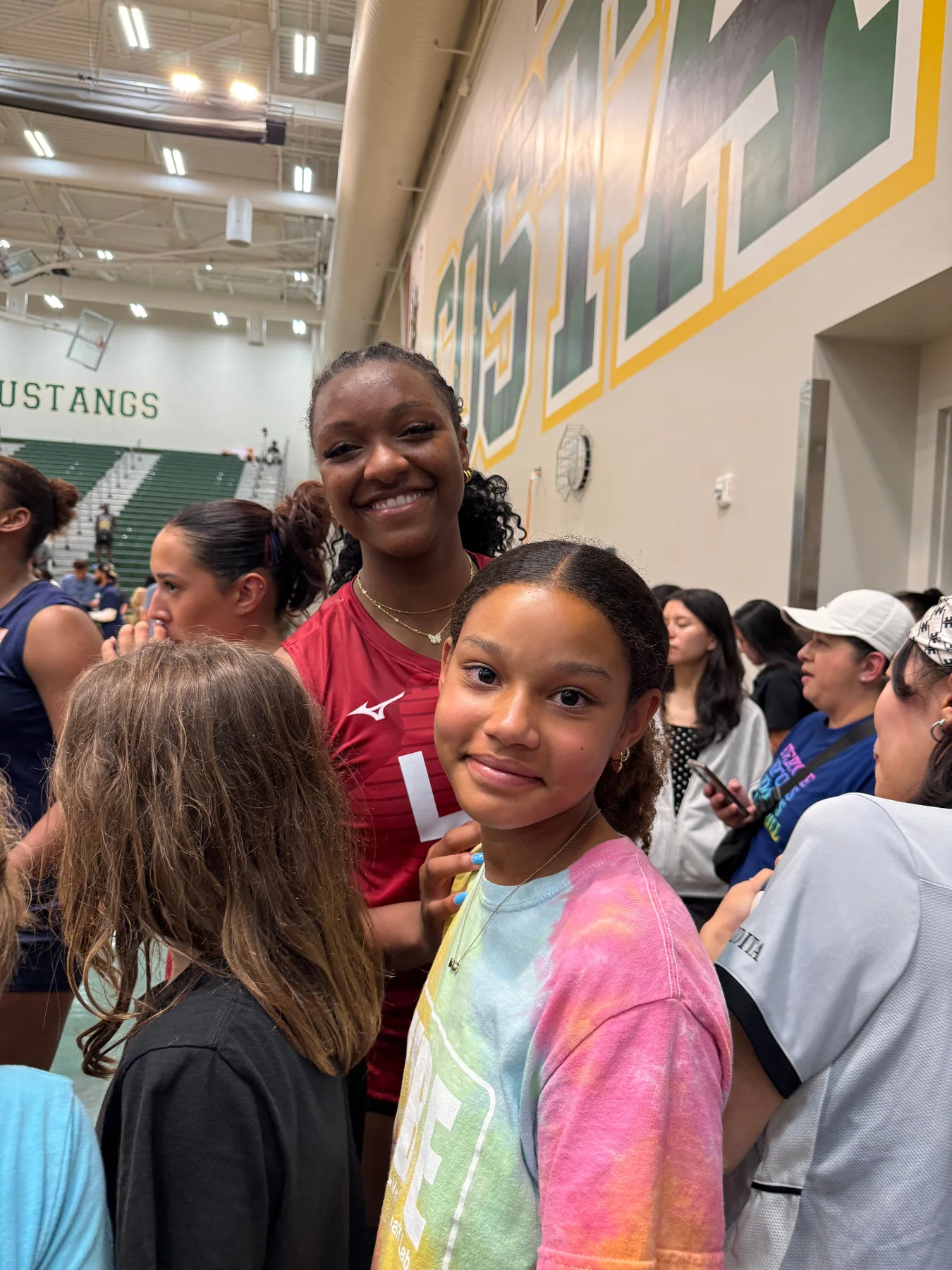 Eva at a volleyball event with an athlete