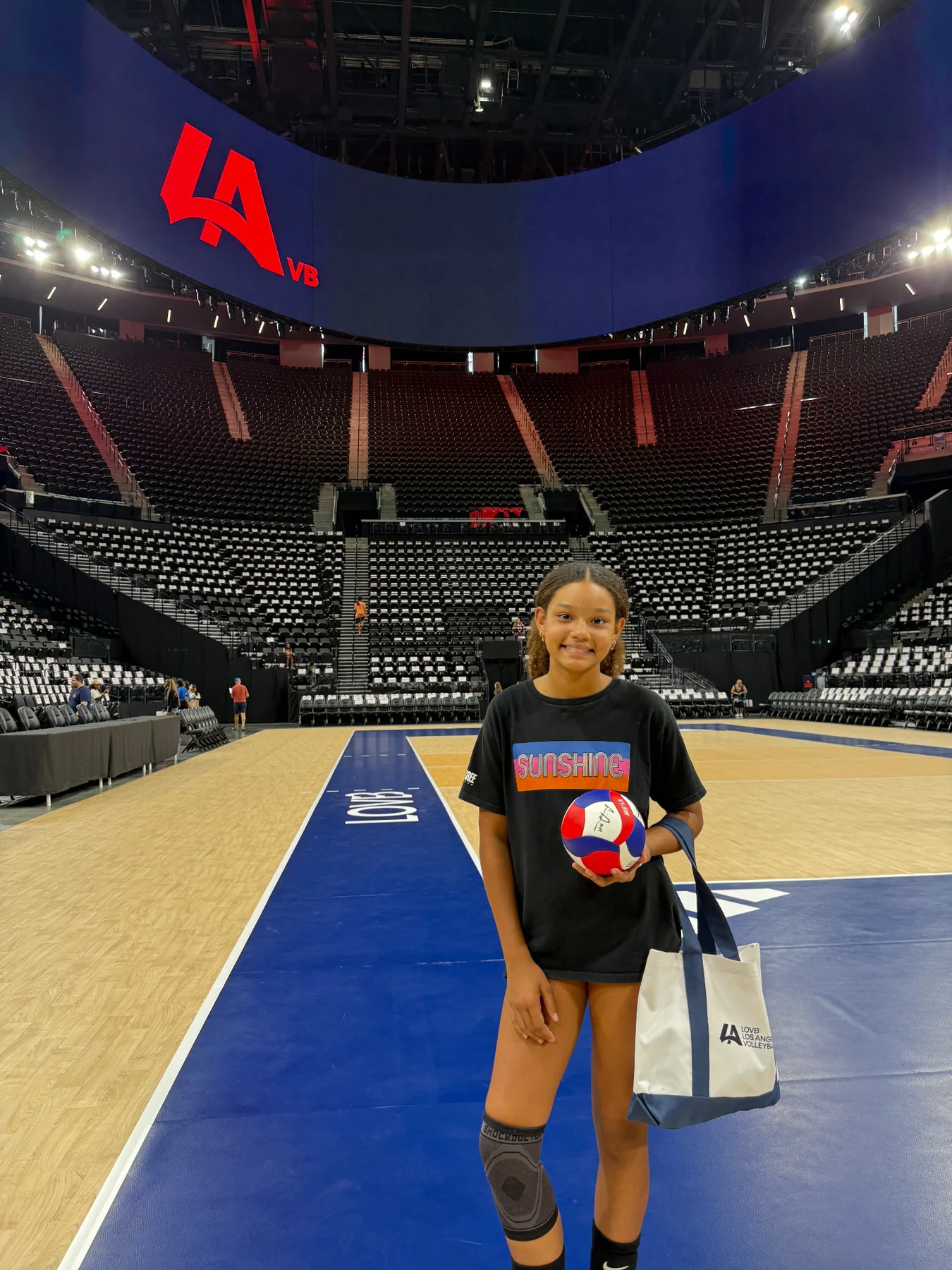 Eva standing on a professional volleyball court