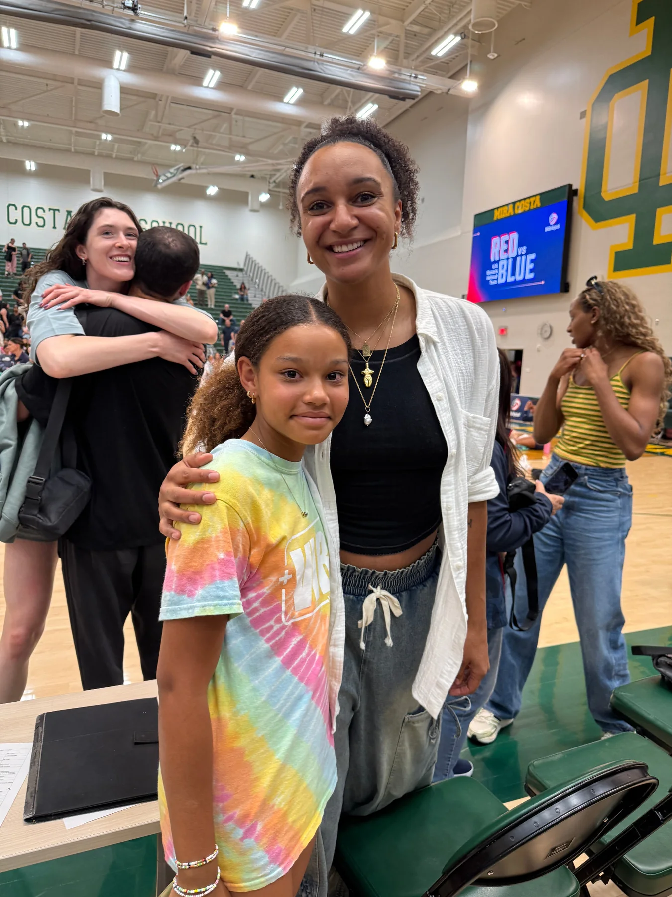 Eva at a volleyball event with an athlete